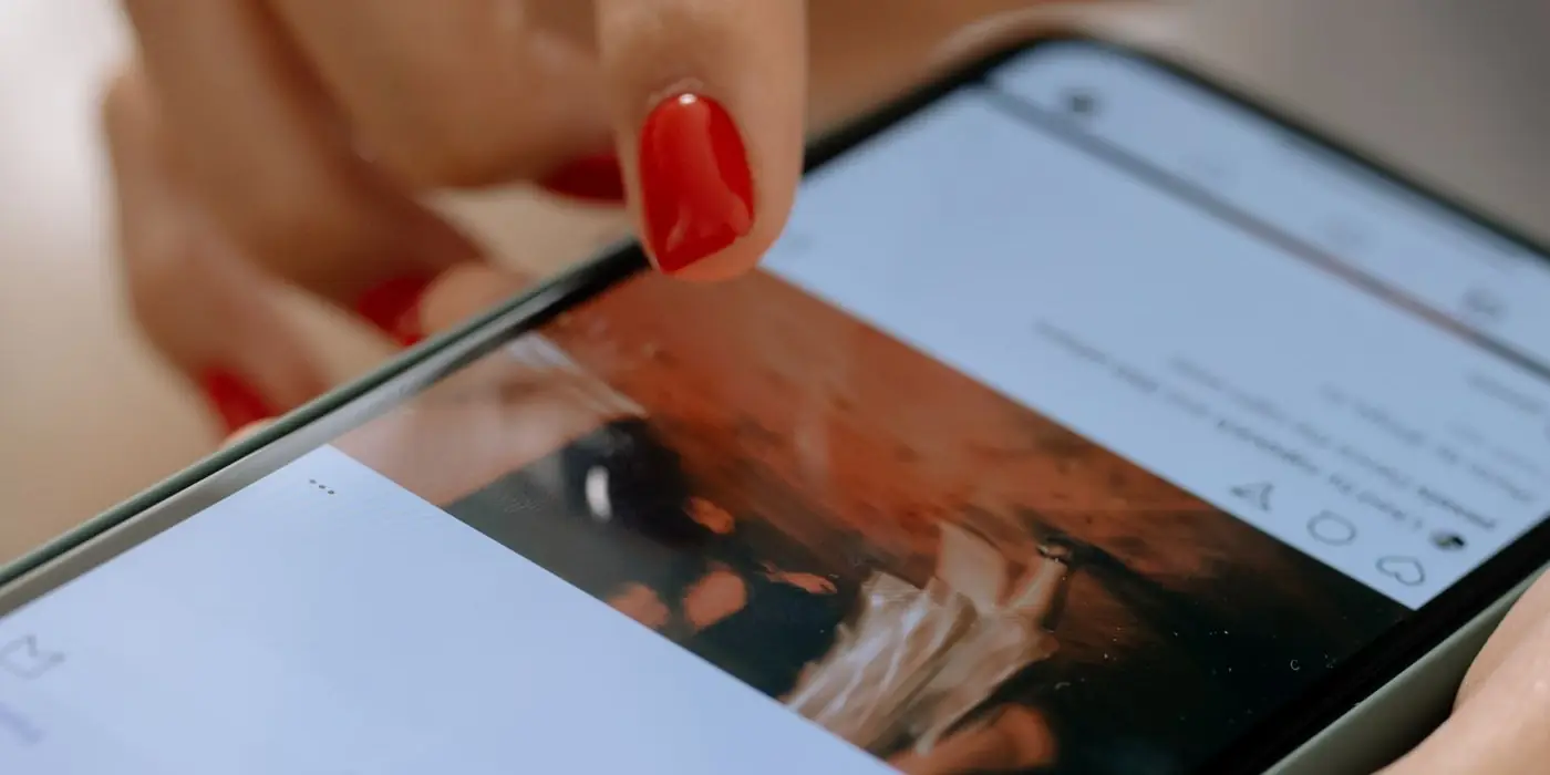 A person reading posts and reviews on a phone